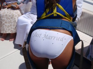 Woman wearing a bikini bottom labeled "Just Married"