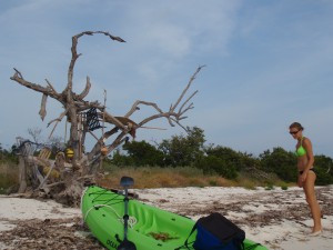 Meredith standing by her kayak on Woman Key