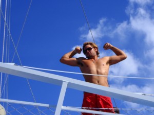Man flexing on the bow of a Fury boat in Key West