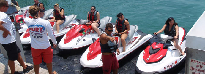 Group of tourists getting ready to ride their jet skiis in Key West