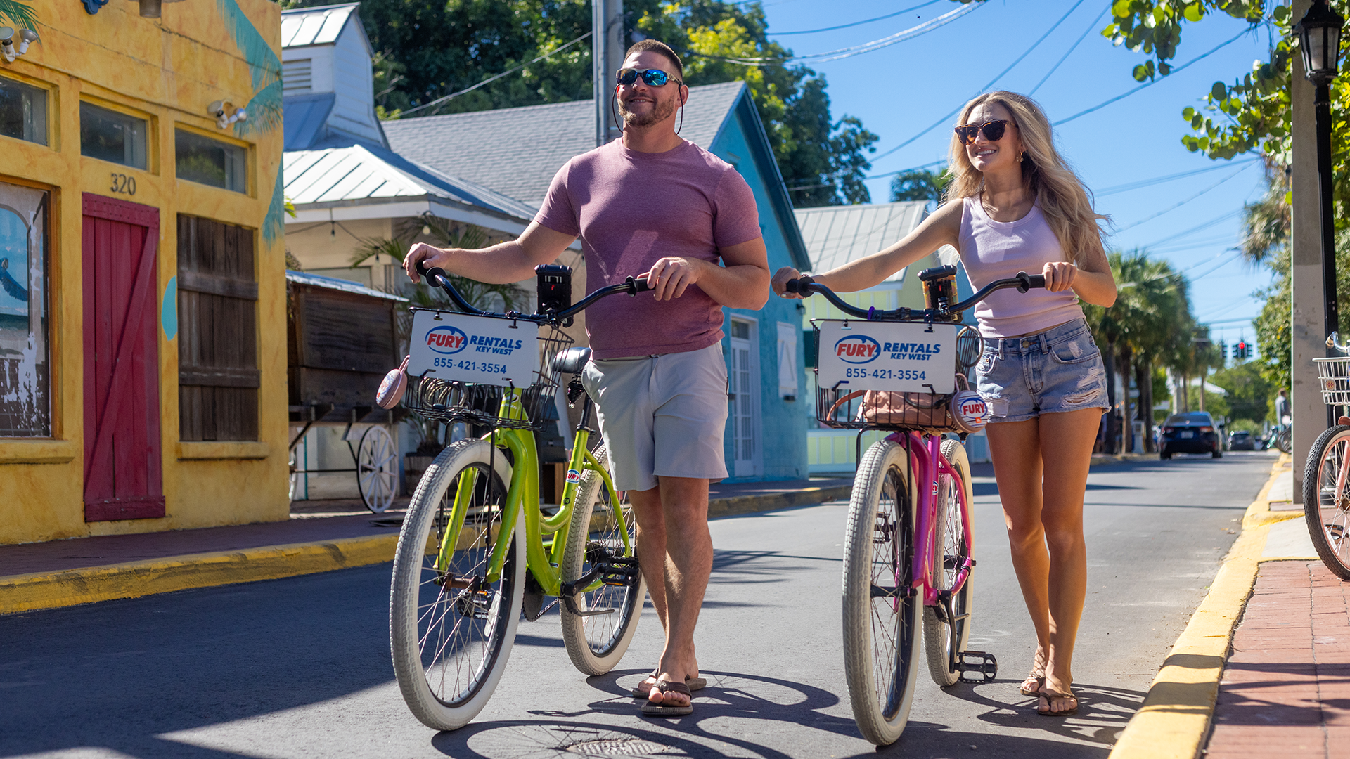 Couple walking in key west with Fury bikes
