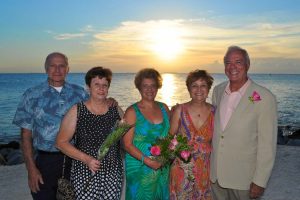 Guests at a wedding party at Fort Zach in Key West with a beautiful sunset in the background