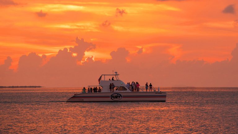 ending the snorkel day with a beautiful orange key west sunset aboard the power catamaran