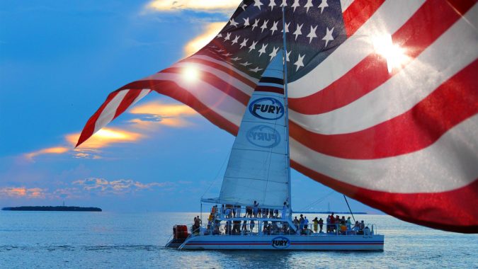 Fury Catamaran during a Key West Sunset with the American Flag