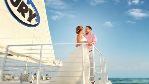 Couple celebrating wedding in Key West aboard Fury catamaran