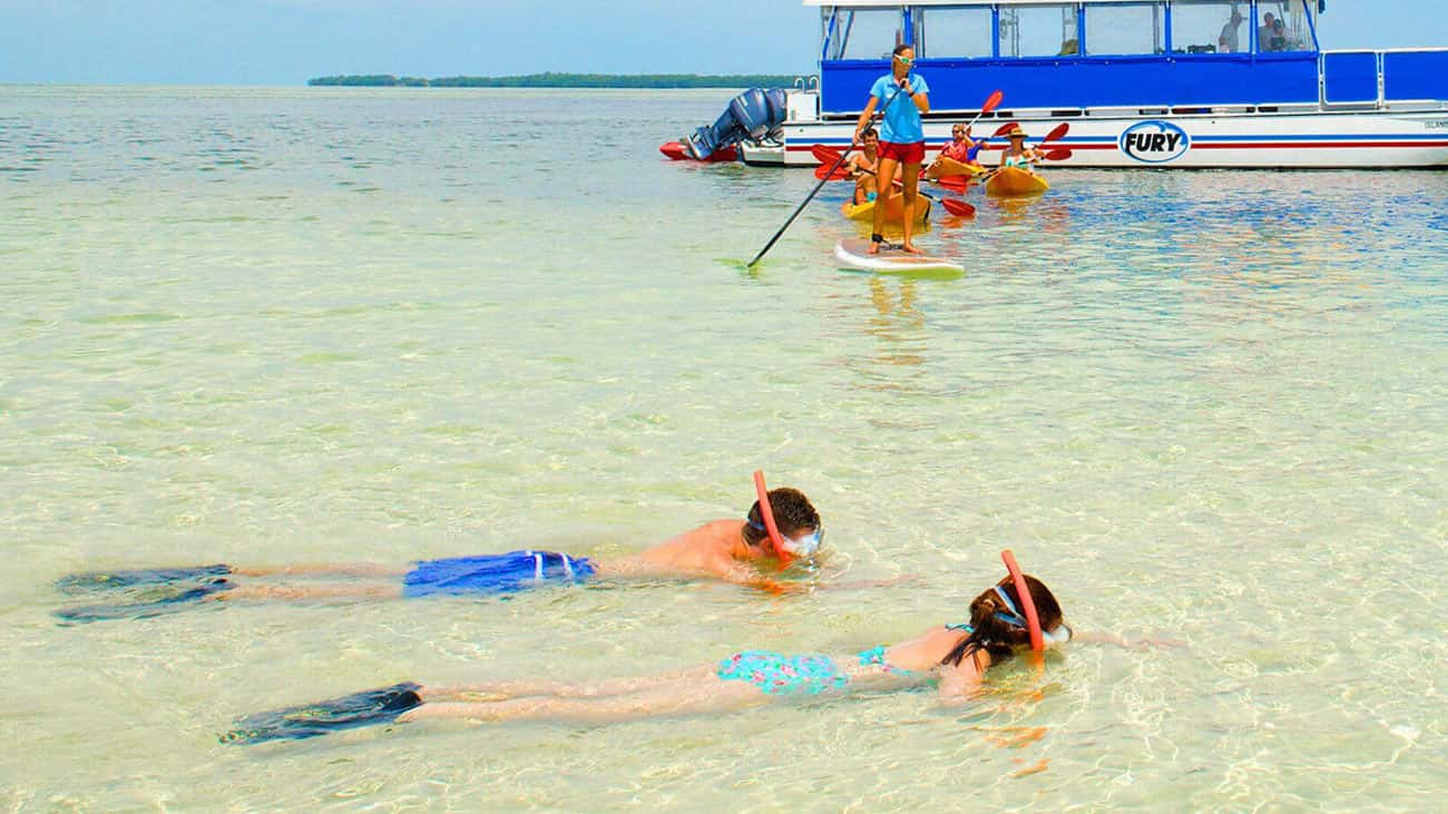 People enjoying various water activities in Key West