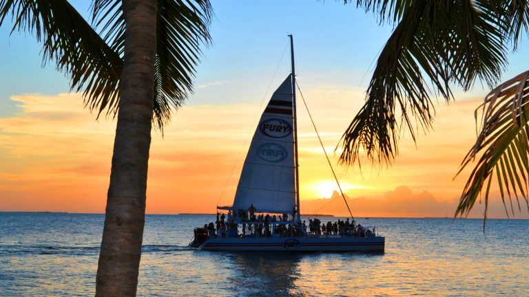 Image of Fury catamaran sailing into Key West sunset