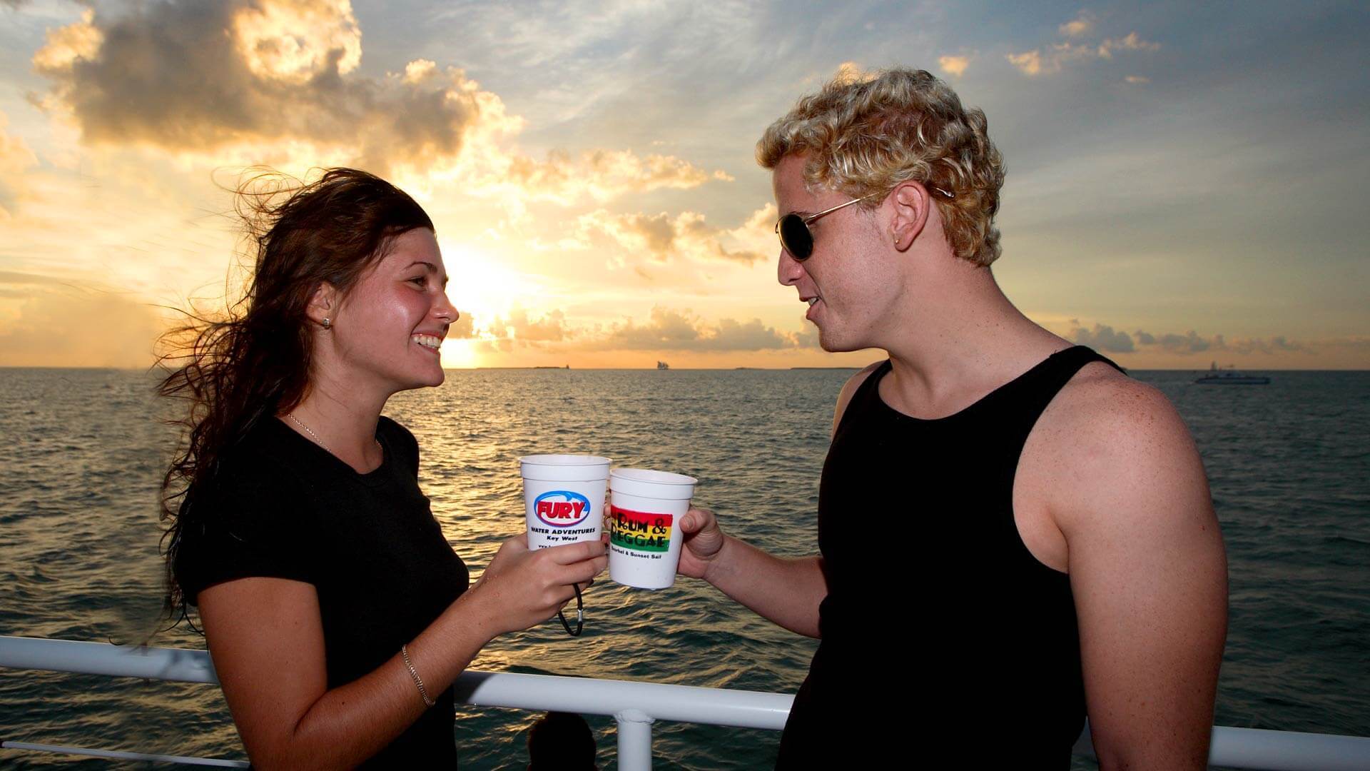 Image of couple toasting on a sunset cruise in Key West
