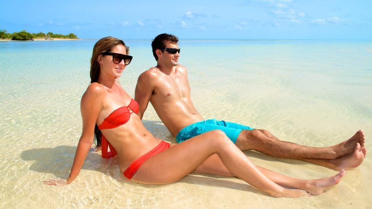 Image of couple relaxing on sandbar in Key West