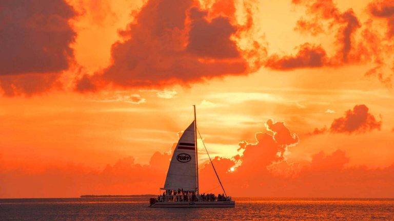 Image of ship on the water during sunset.